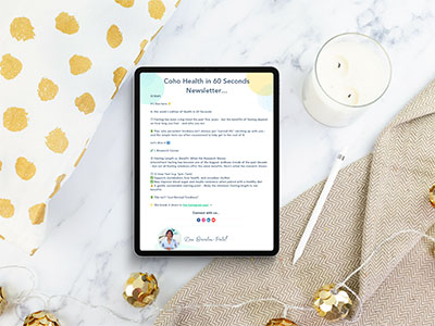 Coho Health Newsletter mockup next to a candle, wrapping paper and blanket